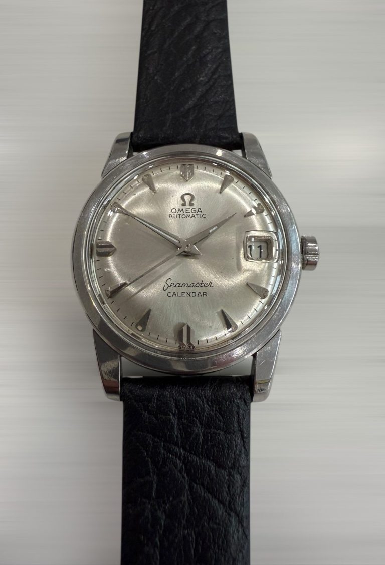 Vintage Omega Seamaster Calendar with a silver dial and black leather strap